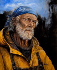 Portrait of an elderly man with a blue bandana and yellow jacket.