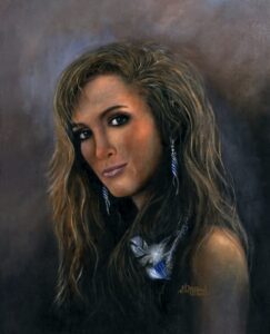 Portrait of a woman with wavy hair and butterfly earrings.