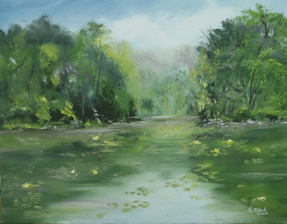 A peaceful river flowing through a lush green forest under a misty sky.